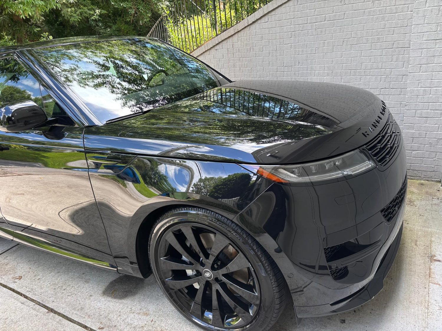 Black Range Rover Sport with deep, mirror-like polished paint